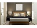 Inviting bedroom featuring a wooden bed frame, decorative pillows, stylish nightstands, and a baseball themed art piece at 5646 Red Kite Dr, Wimauma, FL 33598