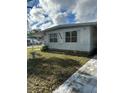 Cozy single-story home featuring a well-manicured lawn, offering a peaceful and inviting curb appeal at 6099 107Th N Ave, Pinellas Park, FL 33782
