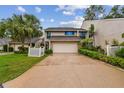 Beautiful two-story home with lush landscaping, a spacious driveway, and an attached two car garage at 4222 Hartwood Ln # 1202, Tampa, FL 33618