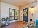 Inviting front porch with tiled floor, decorative plants, and charming decor elements, creating a cozy entrance at 4222 Hartwood Ln # 1202, Tampa, FL 33618