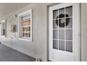 Close-up of the front entrance, highlighting the screen door and the decorative wreath, creating a welcoming appeal at 1390 Oak Hill Dr # 206, Dunedin, FL 34698