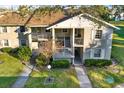 A quaint condo complex featuring well-manicured lawns and inviting outdoor balcony spaces at 1390 Oak Hill Dr # 206, Dunedin, FL 34698