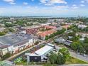 Aerial shot showcasing the neighborhood with beautiful trees, surrounding streets and nearby amenities and ocean views at 2505 W Azeele St, Tampa, FL 33609