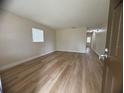 Bright living room with new flooring, fresh paint, and plenty of natural light at 2713 W Chestnut St, Tampa, FL 33607
