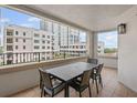 Spacious balcony showing outdoor dining, tile flooring and views of nearby building at 300 Beach Ne Dr # 401, St Petersburg, FL 33701