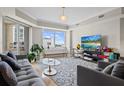 Bright living room featuring neutral decor, comfortable seating, and a sliding door to the outside at 300 Beach Ne Dr # 401, St Petersburg, FL 33701