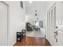 Bright living room featuring a ceiling fan and sliding glass doors to the patio at 13003 Titleist Dr, Hudson, FL 34669