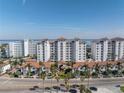 Stunning exterior view of the condo building with lush landscaping and a view of the ocean at 1325 Snell Isle Ne Blvd # 505, St Petersburg, FL 33704