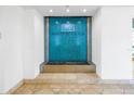 Modern water feature with a teal blue tile backdrop and 'Water Club' logo at 1325 Snell Isle Ne Blvd # 505, St Petersburg, FL 33704