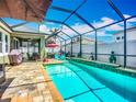 Inviting screened-in pool area with an in-ground pool, outdoor seating, and a relaxing atmosphere at 13608 Artesa Bell Dr, Riverview, FL 33579