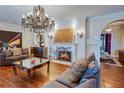 Cozy living room featuring a fireplace, chandelier and comfortable sofas at 1515 Park N St, St Petersburg, FL 33710