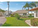Well-maintained home with lush lawn and views of the lake at 1613 Comfy Ct, Sun City Center, FL 33573