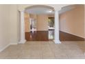 Spacious living room with beautiful wood floors, decorative columns and tiled entryway at 2637 Yukon Cliff Dr, Ruskin, FL 33570