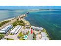Townhome aerial view showcasing a community near ocean waters with waterfront access at 2643 St Josephs W Dr, Dunedin, FL 34698