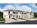 New townhome with neutral exterior, landscaping, and single-car garage at 31326 Ancient Sage Rd, Wesley Chapel, FL 33545