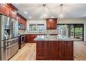 Spacious kitchen with granite countertops, stainless steel appliances, and center island at 3604 Arlington Oaks Ct, Tampa, FL 33618