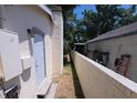 Exterior view of home with brick accent wall and neutral paint at 4607 N 35Th St, Tampa, FL 33610