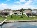 Beautiful backyard with water access and scenic view of the water at 5413 Wishing Arch Dr, Apollo Beach, FL 33572