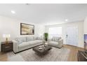 Bright living room featuring neutral furnishings and decor at 6025 Shore S Blvd # 409, Gulfport, FL 33707