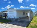 Single-story home with carport, quaint yard and charming curb appeal at 663 54Th S Way # 146, Gulfport, FL 33707