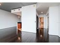 Open-concept living room featuring hardwood floors and seamlessly connecting to the kitchen area at 777 N Ashley Dr # 2608, Tampa, FL 33602