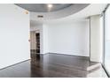 Spacious room with dark hardwood floors and a walk-in closet at 777 N Ashley Dr # 2608, Tampa, FL 33602