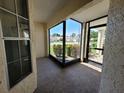 Enclosed porch with view of well maintained landscaping and nearby homes at 946 Madrid Dr, Palm Harbor, FL 34684