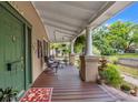 Inviting front porch with ample seating, perfect for enjoying the neighborhood views at 1001 E Crawford St, Tampa, FL 33604