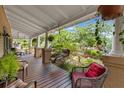 Relaxing front porch featuring comfortable seating and a serene outdoor ambiance at 1001 E Crawford St, Tampa, FL 33604