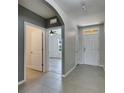 Bright entryway featuring neutral tones and an open view to living area at 10626 Park Meadowbrooke Dr, Riverview, FL 33578
