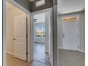 Bright entryway featuring neutral tones and an open view to living area at 10626 Park Meadowbrooke Dr, Riverview, FL 33578