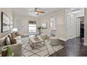 Cozy living room featuring neutral tones, stylish decor, and plenty of natural light at 11811 Cypress Crest Cir, Tampa, FL 33626
