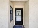The image shows the front door of the unit at 14130 Rosemary Ln # 3215, Largo, FL 33774