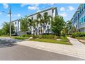 Well-maintained townhome with tropical landscaping and a fenced yard at 202 S Tampania Ave # 3, Tampa, FL 33609