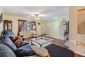 Cozy living room featuring hardwood floors, bright window and comfortable seating at 2308 Rio Cir, Spring Hill, FL 34608