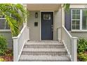 Inviting front entryway showcases brick steps, a sturdy door, and a lantern for added curb appeal at 2933 W Alline Ave, Tampa, FL 33611