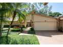 Charming home featuring stone accents and mature landscaping at 3071 Bolt Dr, Palm Harbor, FL 34685