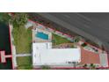 Aerial view of the property highlighting its waterfront location, private pool, and proximity to the beach at 321 N Boulevard Of The Presidents, Sarasota, FL 34236