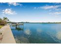 Scenic waterfront view from the property featuring a private dock, perfect for boating enthusiasts at 321 N Boulevard Of The Presidents, Sarasota, FL 34236