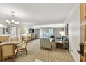 Bright living room with comfortable seating, neutral tones, and a balcony view at 36750 Us 19 N # 07208, Palm Harbor, FL 34684