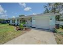 Charming single-story home with a manicured lawn and lovely curb appeal at 402 12Th Sw St, Ruskin, FL 33570