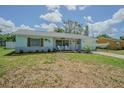 Charming single-story home with a manicured lawn and lovely curb appeal at 402 12Th Sw St, Ruskin, FL 33570