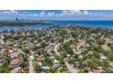 Picturesque aerial view of neighborhood near the bay with partial city skyline at 4291 Neptune Se Dr, St Petersburg, FL 33705