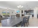 Open concept dining area seamlessly connects with the kitchen and living room at 4690 Coachford Dr, Wesley Chapel, FL 33543