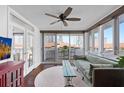 Inviting living room featuring a ceiling fan, a cozy sofa, and a balcony with city views at 470 3Rd S St # 602, St Petersburg, FL 33701
