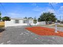 Charming single-story home with a well-maintained front yard and paver driveway at 5405 59Th N St, St Petersburg, FL 33709