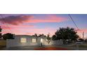 Charming single-story home with a well-maintained front yard and paver driveway at 5405 59Th N St, St Petersburg, FL 33709