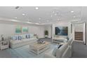 Bright, spacious living area featuring modern furniture, soft blue accents, and ample natural light at 80 Sycamore Ct, Palm Harbor, FL 34683