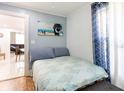 Inviting bedroom with a seaside-themed painting and bright natural light at 945 8Th N St, St Petersburg, FL 33712