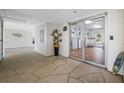 Well-lit lobby area with elevator access and tasteful decor, creating a welcoming atmosphere at 10216 Regal Dr # 208, Largo, FL 33774